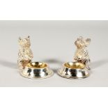 A PAIR OF PLATED MICE SHAPED TABLE SALTS. 2.5ins high.