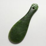 A JADE MAORI HAND CLUB. 7ins long.