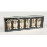 A BOXED SET OF SIX STERLING SILVER PEPPERETTES.