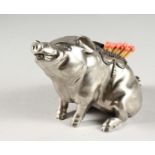 A RUSSIAN SILVER MATCH HOLDER, modelled as a seated pig, inset with small diamonds. 5ins long.