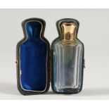 A CUT GLASS SCENT BOTTLE with 18ct gold top, in a fitted case.