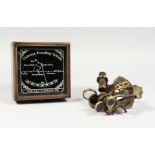 A SMALL REPRODUCTION SEXTANT, boxed. Box 4.5ins wide.