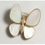 A GOLD, MOTHER-OF-PEARL AND DIAMOND BUTTERFLY BROOCH.