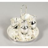 A SILVER PLATED DOUBLE EGG CRUET with chicken salt and pepper.