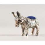 A NOVELTY SILVER DONKEY PIN CUSHION.