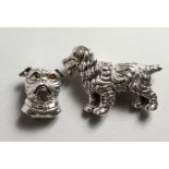 TWO SILVER DOG BROOCHES.