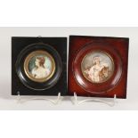 TWO CIRCULAR PORTRAIT MINIATURES OF YOUNG LADIES in wooden frames. 2ins x 2.5ins diameter. Signed.