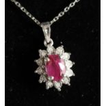 A GOOD 9CT GOLD, RUBY AND DIAMOND PENDANT ON CHAIN.