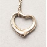 A TIFFANY HEART AND CHAIN in a Tiffany pouch.