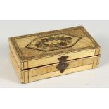 A NAPOLEONIC STRAW WORK BOX AND COVER with floral top. 5.25ins long x 2.75ins wide x 1.75ins deep.
