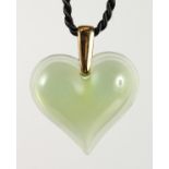 A GREEN LALIQUE HEART PENDANT.