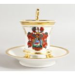 A BERLIN ARMORIAL CUP AND SAUCER.