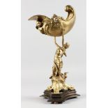 A GILT BRONZE CENTREPIECE modelled as a classical lady holding aloft a conch shell. 16ins high.
