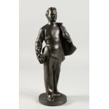 A RUSSIAN METAL STANDING FIGURE OF A MAN, a cape over his shoulders. 11.5ins high.