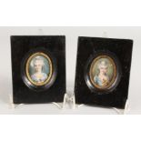 A PAIR OF OVAL PORTRAIT MINIATURES OF A YOUNG LADY in wooden frames. 1.75ins x 1.5ins. Signed.