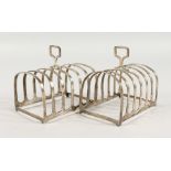 A PAIR OF SIX-DIVISION SILVER TOAST RACKS. Birmingham 1919.