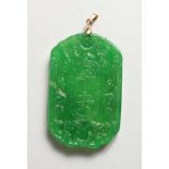 AN APPLE GREEN JADE PENDANT. 2.25ins diameter.