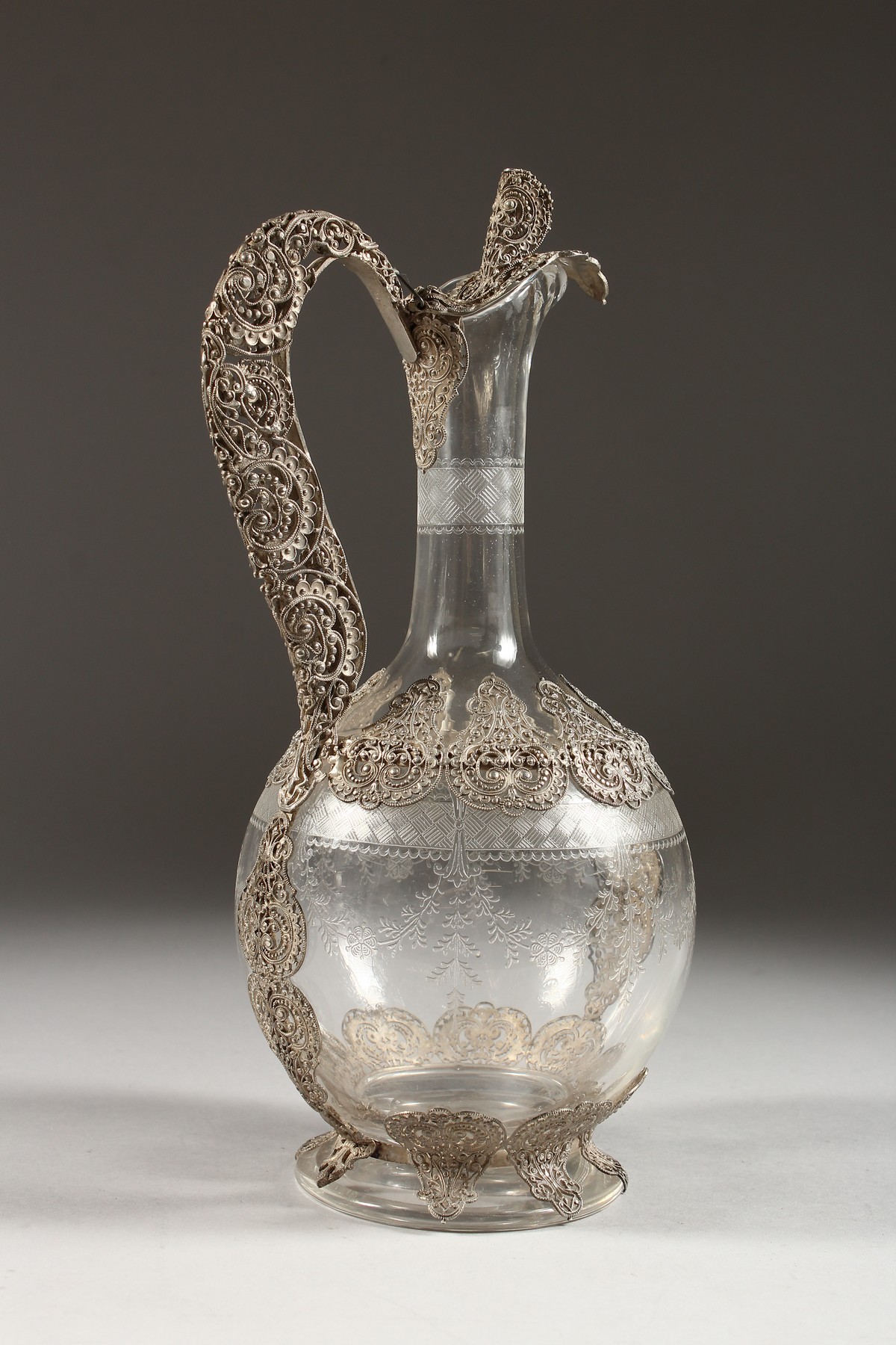 A SUPERB FILIGREE SILVER AND ETCHED GLASS CLARET JUG. 10.5ins high. - Image 2 of 5