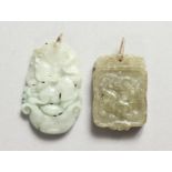 TWO SMALL JADE PENDANTS. 1.25ins.