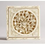 A CANTON SQUARE, CARVED AND PIERCED PUZZLE, four pieces in two layers. 2ins square.