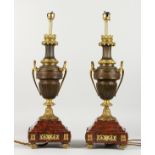 A SUPERB PAIR OF FRENCH MARBLE AND ORMOLU TWO-HANDLED URN SHAPED LAMPS on square bases. 20ins high.