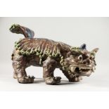 A LARGE ORIENTAL CERAMIC SHI DOG. 19ins long.