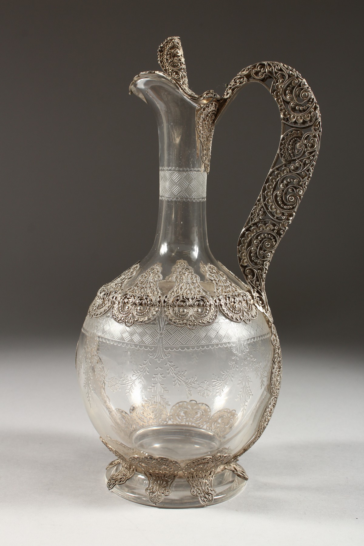A SUPERB FILIGREE SILVER AND ETCHED GLASS CLARET JUG. 10.5ins high. - Image 3 of 5