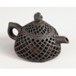 A CHINESE PIERCED POTTERY TEAPOT.