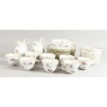 A GOOD MEISSEN PART TEA SET, sprigged with flowers, comprising eight plates, two milk jugs, eight