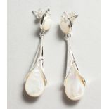 A PAIR OF SILVER AND PEARL EARRINGS.