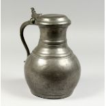 A LARGE FRENCH PEWTER JUG AND COVER.