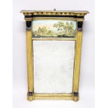 A REGENCY GILTWOOD PIER MIRROR, with painted glass panel and sphinx supports. 3ft 6ins high x 2ft