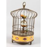 A NOVELTY BIRD CAGE CLOCK. 8ins high.