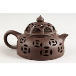 A CHINESE PIERCED POTTERY TEAPOT.