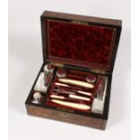 A GOOD VICTORIAN ROSEWOOD BRASS BOUND VANITY CASE, for J. W. McFIE, with three tier fitted interior,