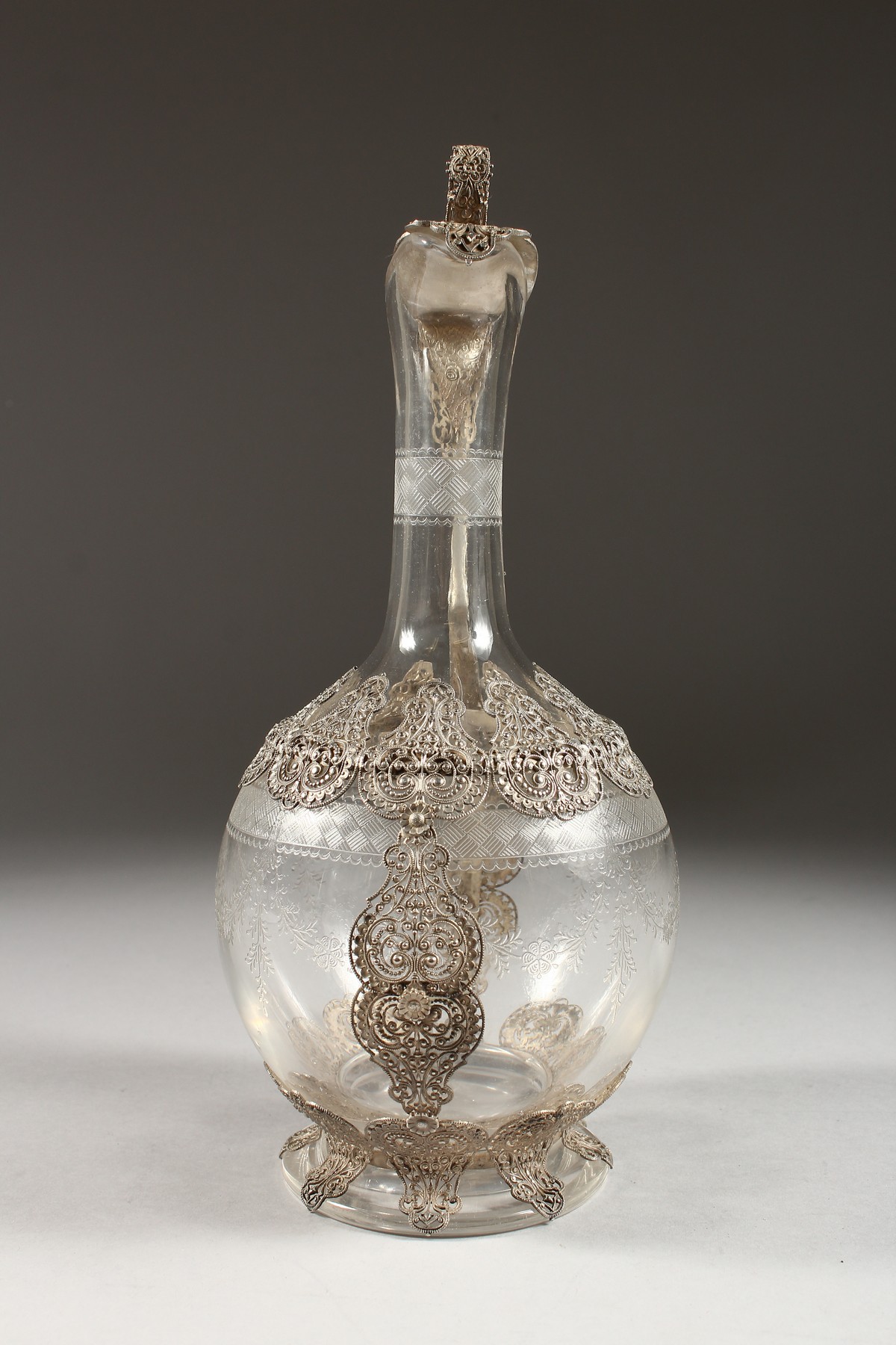 A SUPERB FILIGREE SILVER AND ETCHED GLASS CLARET JUG. 10.5ins high. - Image 4 of 5