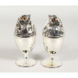 A PAIR OF SILVER PLATED CHICK EGG CUPS. 4.5ins high.