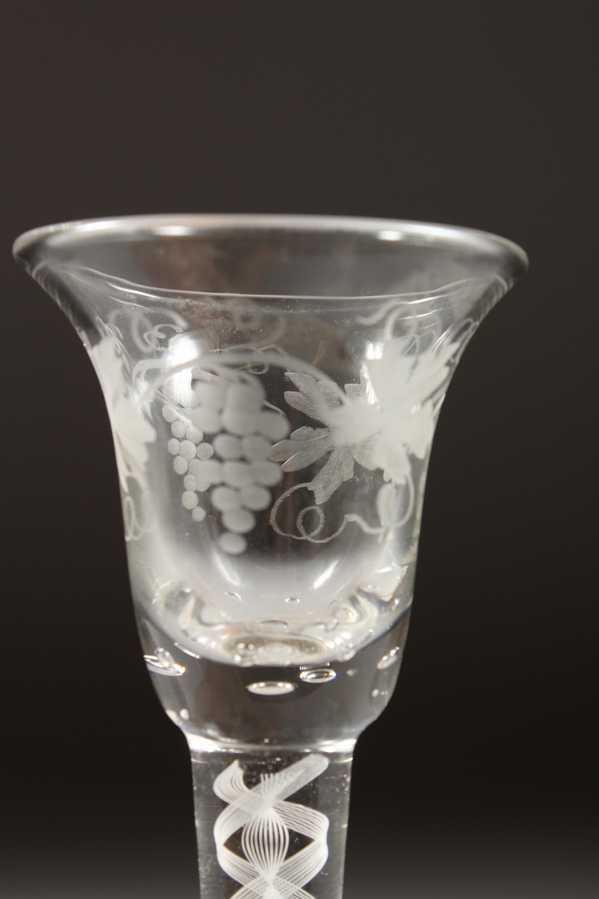 A GEORGIAN WINE GLASS, with inverted bell bowl etched with fruiting vines, with white air twist - Image 4 of 10