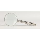 A MAGNIFYING GLASS.