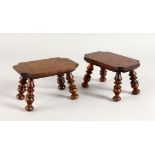 A PAIR OF WOODEN CANDLE STANDS on turned legs. 6ins.