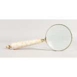 A MAGNIFYING GLASS.