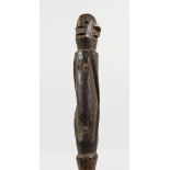 A CARVED TRIBAL HOUSE MARKER. 13.5ins long.