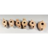 SIX VARIOUS ROMAN TERRACOTTA OIL LAMPS.