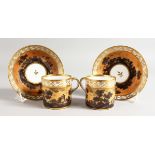 A DARTE FRERES PAIR OF COFFEE CANS AND SAUCER, the can with typically shaped handles painted en-