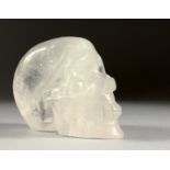 A ROCK CRYSTAL SKULL. 5ins long.