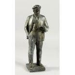 A RUSSIAN METAL STANDING FIGURE OF LENIN reading a book, inscribed on side of base. 14ins high.
