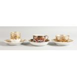 A SPODE COFFEE CUP AND SAUCER AND A TEACUP AND SAUCER superbly decorated in raised gold in Empire