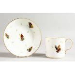 A PARIS PORCELAIN COFFEE CAN AND STAND painted with butterflies and gold sprigs.