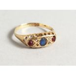 AN 18CT GOLD, RUBY AND SAPPHIRE RING.