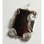 A SILVER AND TIGER'S EYE PENDANT.